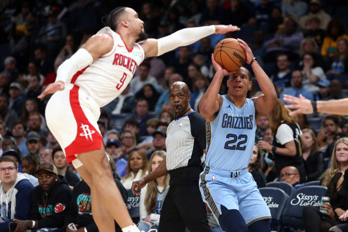 Grizzlies guard Desmond Bane shoots for three as Houston Rockets forward Dillon Brooks (9) defends during the first half at FedExForum.